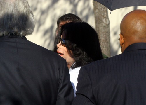 SANTA MARIA, CA JANUARY 31 : Pop Star Michael Jackson is escourted by Thomas Mesereau (l) and sucuri