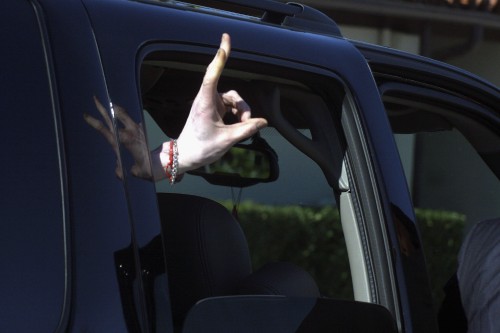 SANTA MARIA, CA - JANUARY 31:  Pop Star Michael Jackson signals to his fans as he departs the Santa 