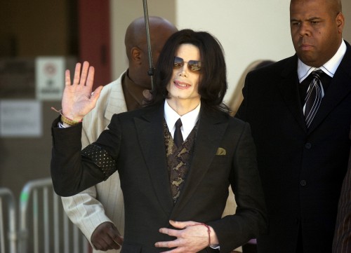 Michael Jackson waves to fans while departing the Santa Barbara County Superior Court on March 9, 20