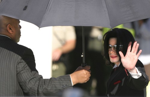 SANTA MARIA, CA - May 11: Michael Jackson waves to his supporters as he arrives outside the Santa Ba