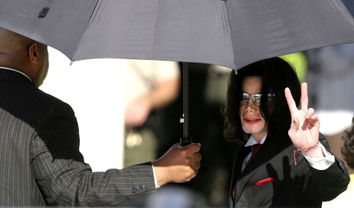 SANTA MARIA, CA - May 11: Michael Jackson waves to his supporters as he arrives outside the Santa Ba