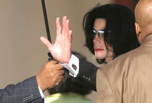 SANTA MARIA, CA - May 12: Michael Jackson waves to his supporters as he arrives outside the Santa Ba