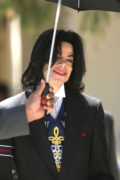 SANTA MARIA, CA - MAY 23: Michael Jackson smiles as he leaves the Santa Barbara County Courthouse af