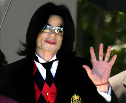 Pop superstar Michael Jackson gestures to his supporters as he departs from the Santa Barbara Superi